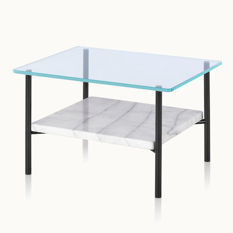 Angled view of a Layer side table with a glass top and marble lower shelf.