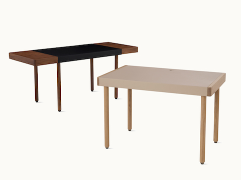 Two Leatherwrap Sit-to-Stand Desks in walnut and oak finishes, viewed at an angle.