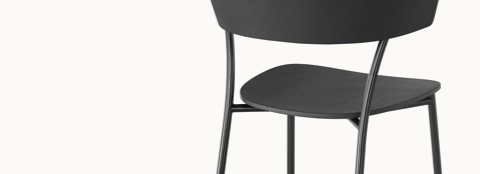 A black Leeway Stool, viewed from behind at an angle to show the metal frame and polyurethane backrest and seat.