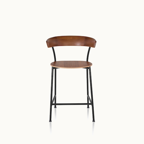 A Leeway Stool with a black metal frame and a wood backrest and seat in a medium finish, viewed from the front.