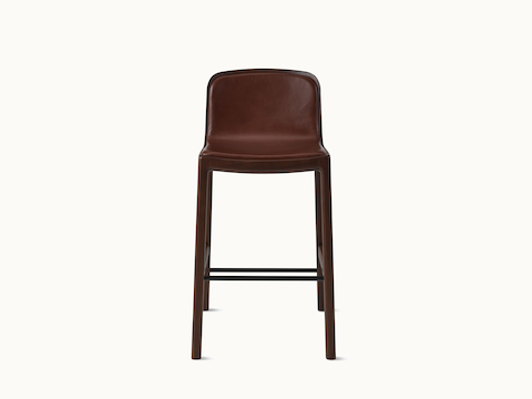 Lijn Stool by Carole Baijings for Geiger in Persian Walnut frame upholstered with Maharam Hue Leather in Bittersweet, front view on a white sweep. Lijn Stool by Carole Baijings for Geiger in Persian Walnut frame upholstered with Maharam Hue Leather in Bittersweet, front view on a white sweep.
