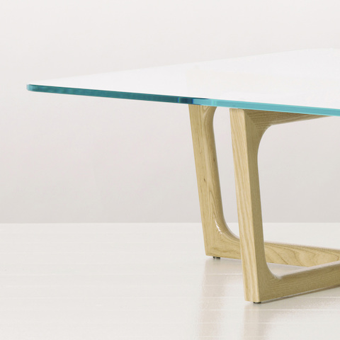 Partial view of a Loophole occasional table, focusing on the half-inch-thick glass top.