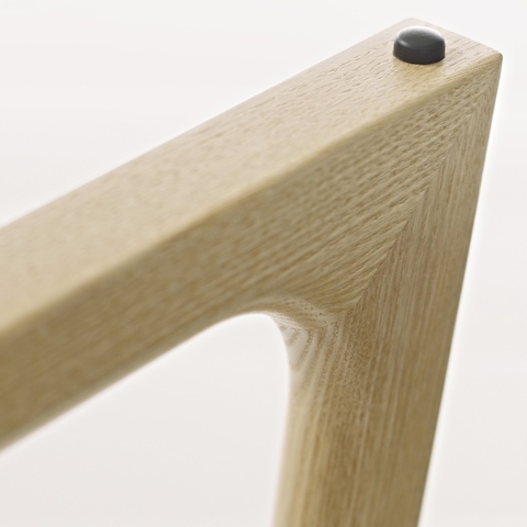 Close-up of a corner on the base of a Loophole occasional table, showing the precision wood craftsmanship.