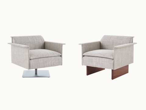 Two Mantle Club Chairs facing each other at 45-degree angles, one with a metal base and one with a wooden base.  