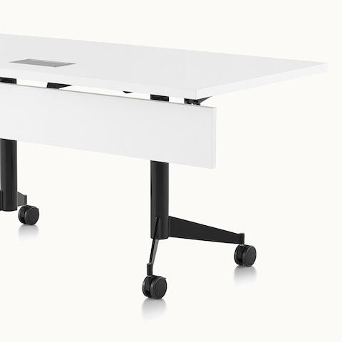Partial angled view of a rectangular MP Flex Table, focusing on the lockable casters.