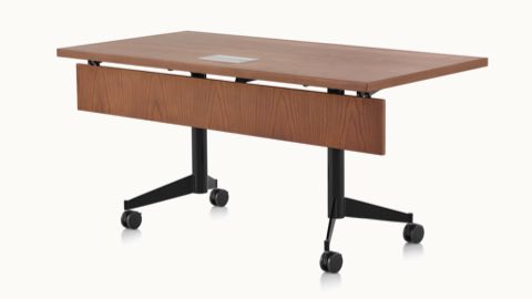A rectangular MP Flex Table with a chocolate ash finish and black base, viewed at an angle. A rectangular MP Flex Table with a chocolate ash finish and black base, viewed at an angle.