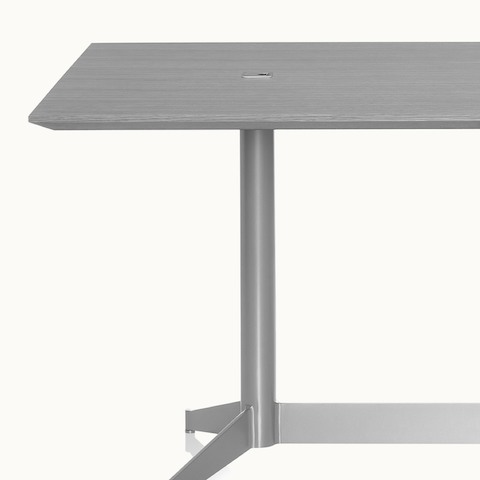 Partial view of a gray MP Table with integrated power and data access.