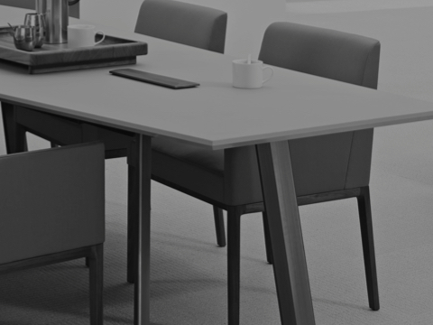 Black-and-white image of Nessel side chairs on either side of a Geiger Elsi conference table.