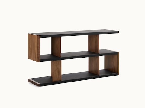 New Canaan Low Bookshelf designed by BassamFellows for Geiger in Walnut with Black Leather shown angled on a white sweep.