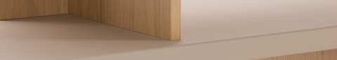 Detail shot of New Canaan Low Bookshelf designed by BassamFellows for Geiger in Oak with Champagne Leather shown angled on a white sweep.