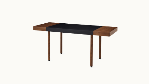New Canaan Leatherwrap Sit-to-Stand Desk in walnut and black leather, two drawers, angled view. New Canaan Leatherwrap Sit-to-Stand Desk in walnut and black leather, two drawers, angled view.