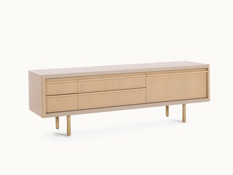 New Canaan Media Unit designed by BassamFellows for Geiger in Oak with Champagne Leather shown angled in a residential setting.