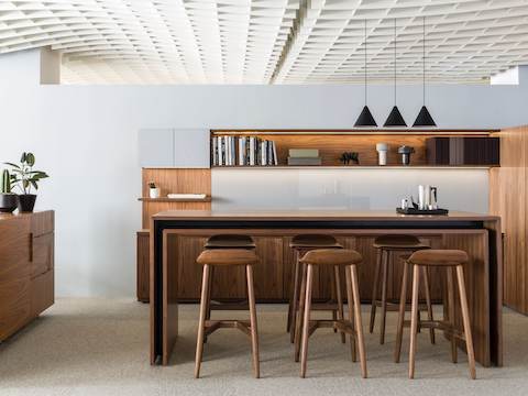 An open collaboration space featuring a rectangular Peer Table and six Crosshatch Stools to support impromptu interaction.