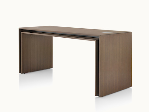 A rectangular Peer Table in a dark wood finish, viewed at an angle.