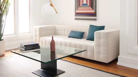 A lounge area featuring a Rapport Sofa and I Beam Table.