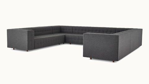 A three-seat Rapport Sofa in a deep navy colored textile.  