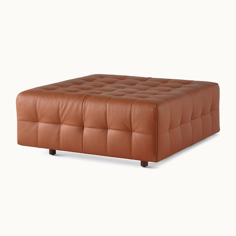 A Rapport ottoman upholstered in leather.
