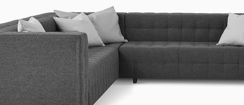 A Rapport sofa in a u-shaped configuration with throw pillows. A Rapport sofa in a u-shaped configuration with throw pillows.