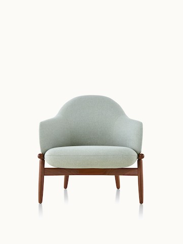 A mid-back Reframe lounge chair with light green upholstery and a wood frame in a medium finish, viewed from the front.