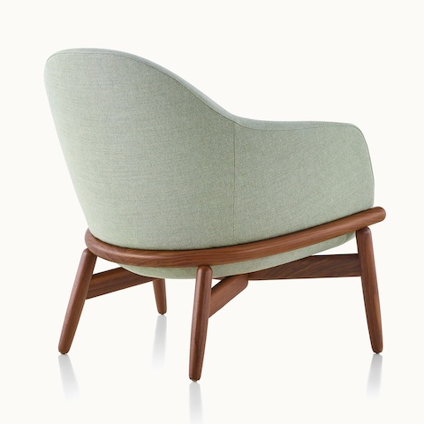 A mid-back Reframe lounge chair, viewed from behind at an angle to show the wood frame.