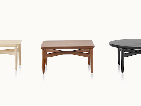 Three Reframe occasional tables with light, medium, and black finishes.