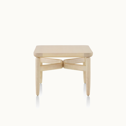 A square Reframe occasional table with a light wood finish.