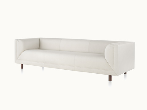 Angled view of an off-white sofa from the Rolled Arm Sofa Group.