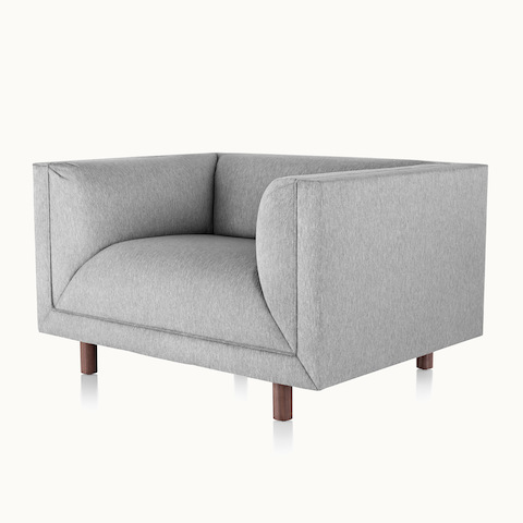 Angled view of a light gray club chair from the Rolled Arm Sofa Group, showing the low seat height.