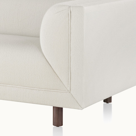 Close-up of a lower corner on an off-white sofa from the Rolled Arm Sofa Group, showing the mitered upholstery.