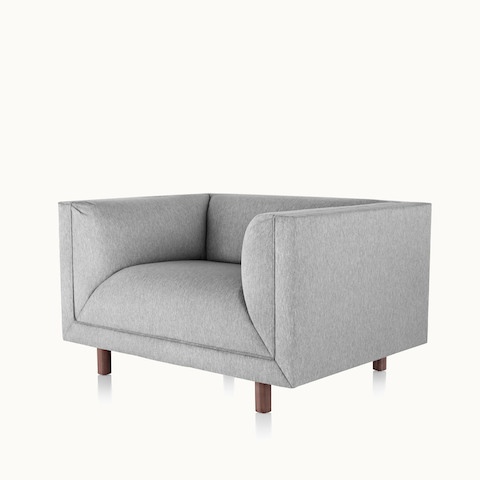 Angled view of a light gray club chair from the Rolled Arm Sofa Group. Select to go to the Rolled Arm Sofa Group product page.