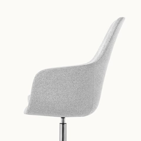 Side view of a high-back Saiba Chair with light gray upholstery.