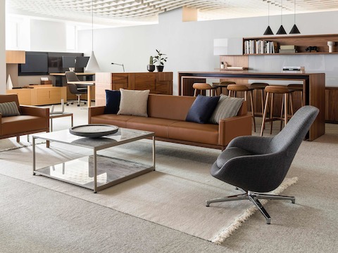 An open office featuring work, collaboration, and sitting areas with a variety of seating, including a gray Saiba Lounge Chair.