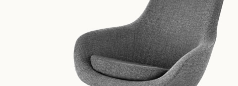 Angled view of the seat and back of a Saiba Lounge Chair with gray upholstery.