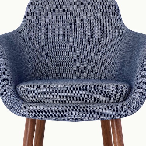 Partial front view of a Saiba Side Chair with blue upholstery, showing the impeccably tailored bucket seat.