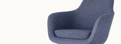 Angled view of the seat and back of a Saiba Side chair with blue upholstery.