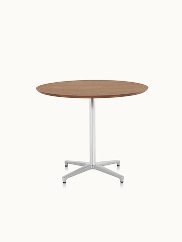 A round Saiba occasional table with a veneer top and aluminum pedestal base.