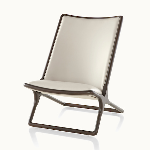 Angled view of a Scissor lounge chair with ivory-colored leather upholstery, showing the rectangular structure.