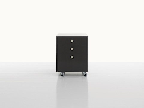 A Sled Base Storage mobile pedestal with a dark wood finish, casters, two box drawers, and one file drawer.