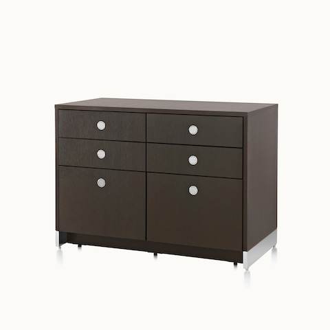 Angled view of a storage unit with a dark wood finish, four box drawers, and two file drawers. Select to go to the Sled Base Storage product page.