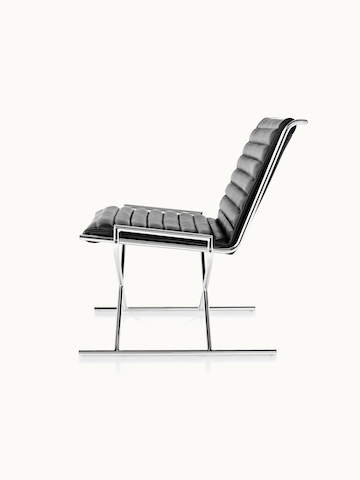Side view of a Sled lounge chair with ribbed black leather upholstery.