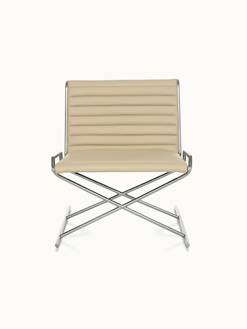 A Sled lounge chair with ribbed beige leather upholstery and an X-shaped steel frame, viewed from the front.