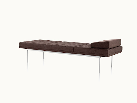 Angled view of a quilted Tuxedo Component daybed upholstered in dark brown fabric.