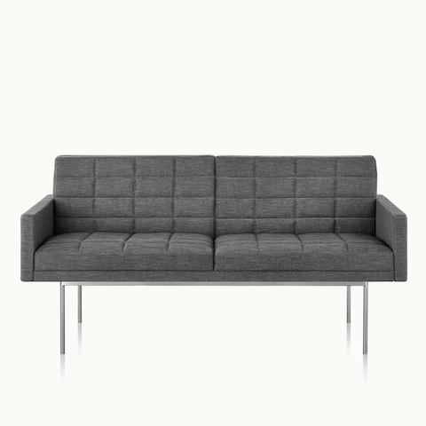 A quilted Tuxedo Component settee upholstered in gray fabric, viewed from the front.