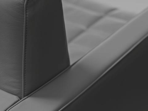 Close-up of a back corner on a Tuxedo Component club chair, showing the stitching detail. Close-up of a back corner on a Tuxedo Component club chair, showing the stitching detail.