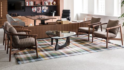 An executive office featuring Geiger Rhythm Casegoods along the back wall and a sitting area with Crosshatch Chairs in the foreground.