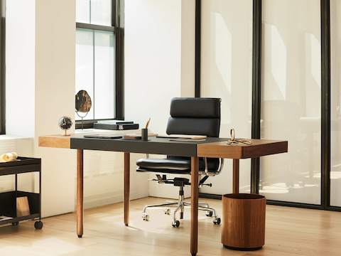 Leatherwrap Sit-to-Stand Desk in walnut and black leather, front view.