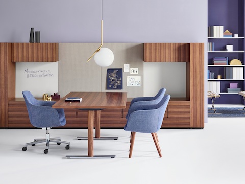 A private office featuring Geiger Rhythm Casegoods, a freestanding desk, and Saiba office and side chairs in matching light blue fabric.