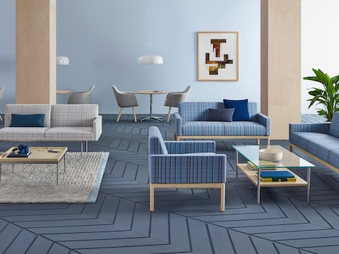 An open collaboration area featuring a mix of lounge furniture and occasional tables.