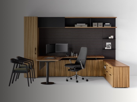 A private office featuring Geiger One Casegoods with a peninsula work surface and storage, a Taper office chair, and two Full Twist Guest Chairs.